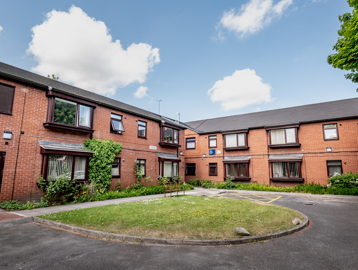 William Griffiths Court External Bench and green area outside the scheme