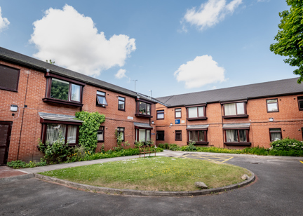 William Griffiths Court External Bench and green area outside the scheme