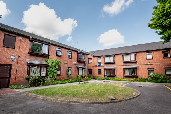 William Griffiths Court External Bench and green area outside the scheme
