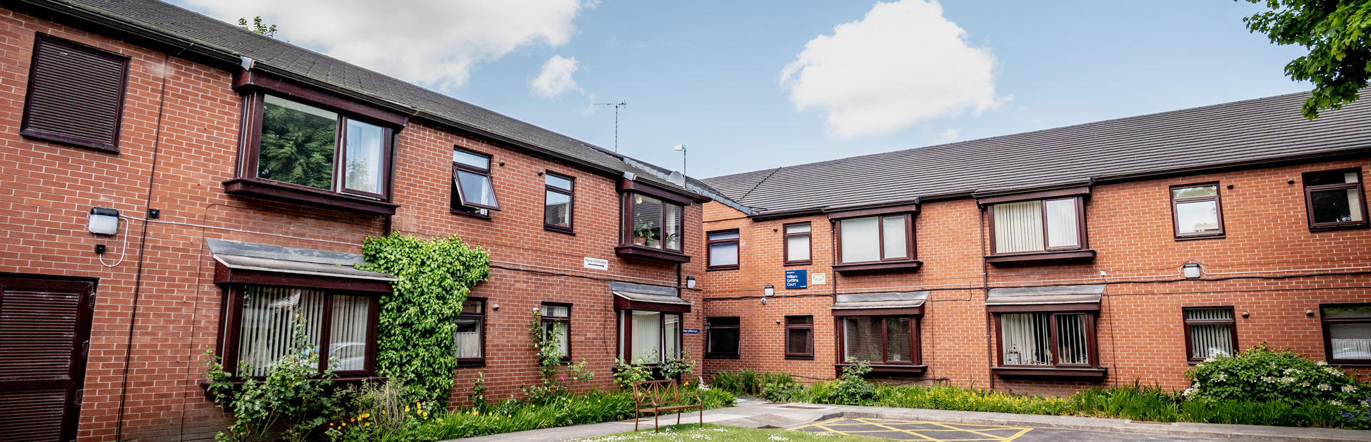 William Griffiths Court External Bench and green area outside the scheme