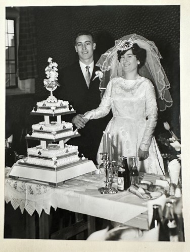 David and Shirley on their wedding day in March 1964 cutting their wedding cake.