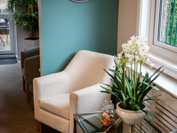 Modern sitting area with clock on the wall