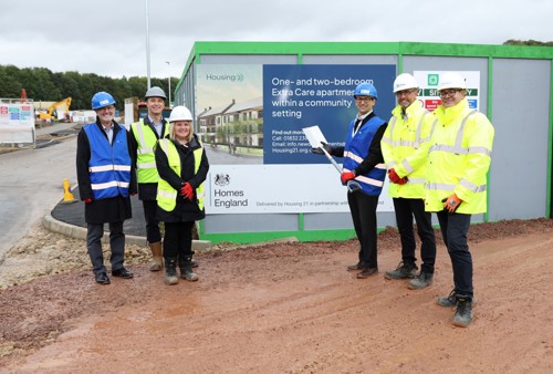 People in high-vis vests and hard helmets at the ground breaking ceremony