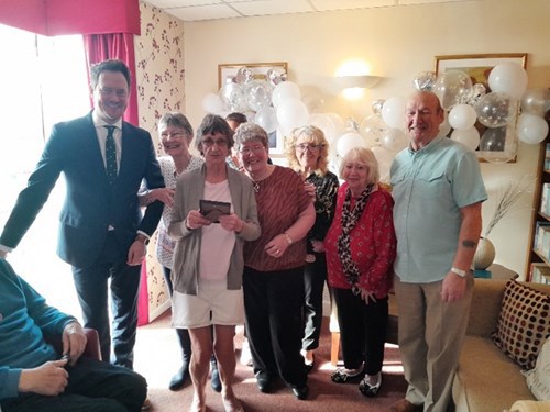 Pictured: Stephen Morgan MP (left) and some residents at Alexandra Court