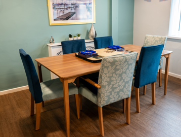 Communal dining area with tables and chairs