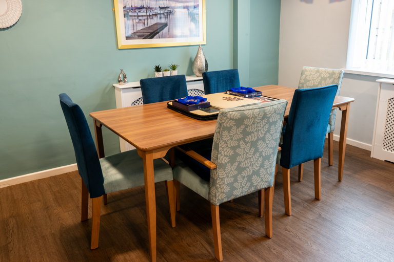 Communal dining area with tables and chairs