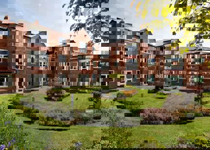 Large rear garden with plants and flowers at Springhill Court