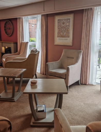 A communal seating area with armchairs 
