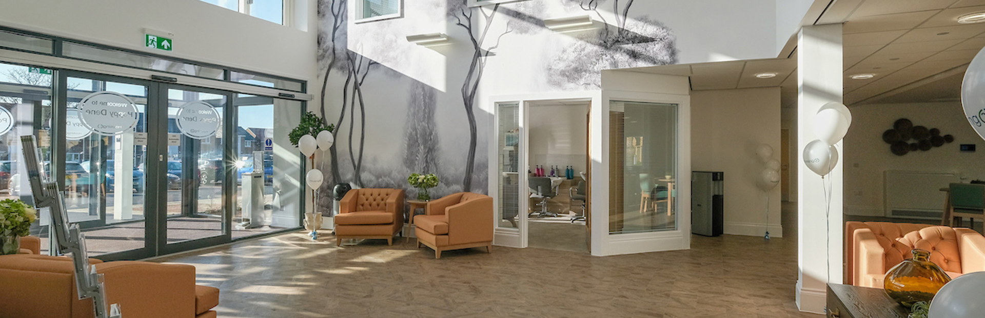 Entrance area to Poppy Dene with soft seating and tables in the foyer