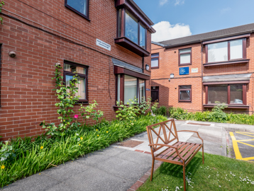 William Griffiths Court External bench and seating area with green gardens