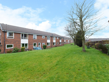 External photo of the main building of Smalley Court surrounded by large grass area