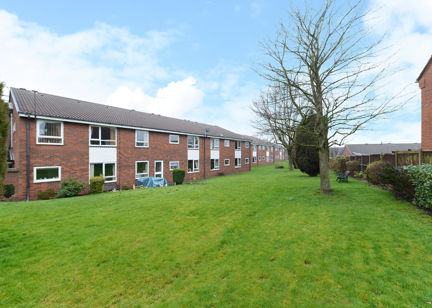 External photo of the main building of Smalley Court surrounded by large grass area