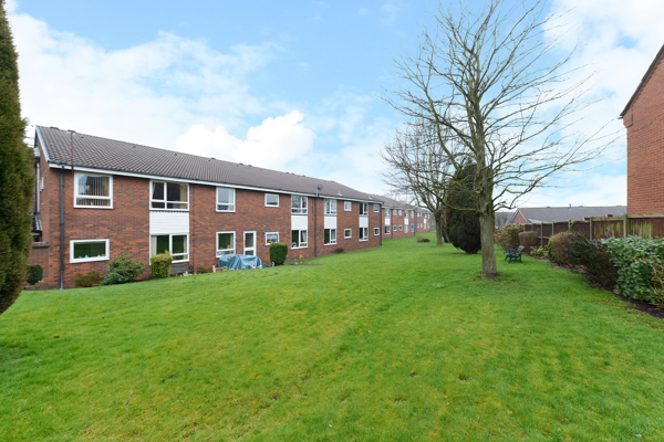 External photo of the main building of Smalley Court surrounded by large grass area