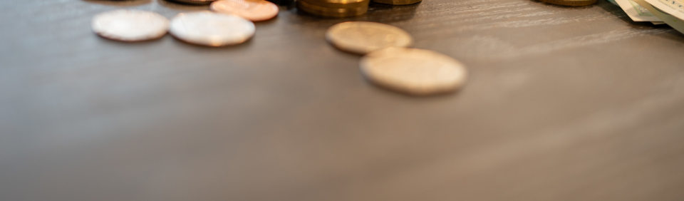 A collection of British monetary coins and notes on a table  