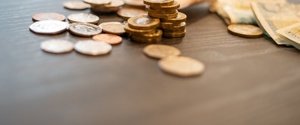 A collection of British monetary coins and notes on a table
