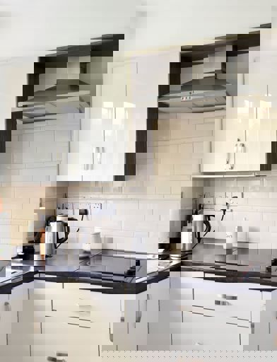 Small white kitchen in a resident's apartment