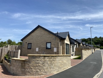 A photo of outside of a bungalow on a corner plot at Castlestead View