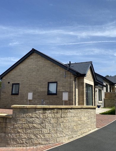 A photo of outside of a bungalow on a corner plot at Castlestead View 