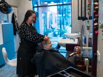 A resident enjoying her visit to the on-site salon at Lime Gardens