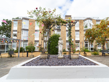 A three storey residential building overlooking a courtyard