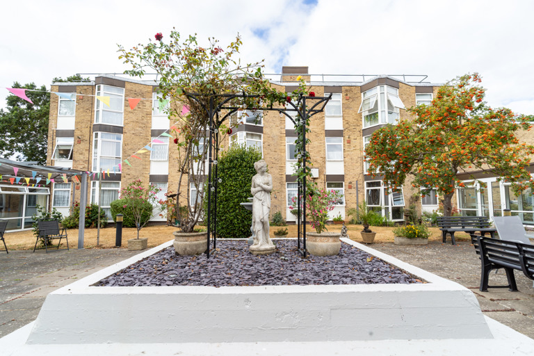 A three storey residential building overlooking a courtyard