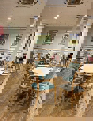 Four chairs around a table in a communal area