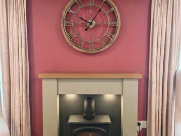 An electric fireplace made to look like a traditional wood burner