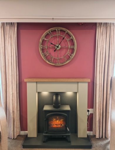 An electric fireplace made to look like a traditional wood burner 