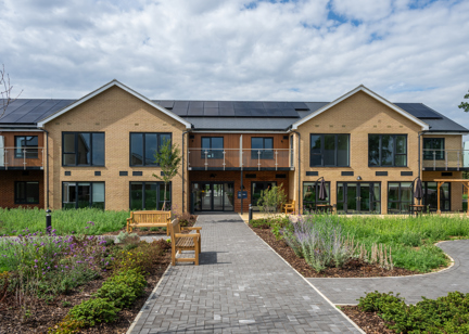 Outer building of Michaelmas Court surrounded by greenery 