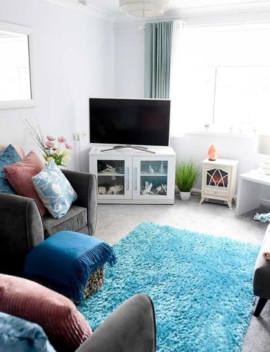 A bright and cosy living room in an apartment at Goodman Court 