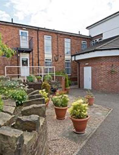 A photo of the front entrance of Devonshire Court 