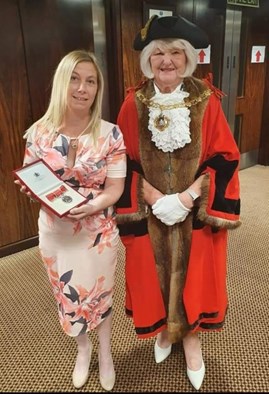 Pictured: Joanne receiving her British Empire Medal
