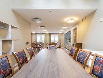 a large dining table and chairs 