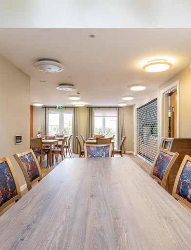 a large dining table and chairs  