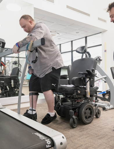 Chris, a Housing 21 resident, undertakes physiotherapy exercises under the supervision of his physio, Marc 