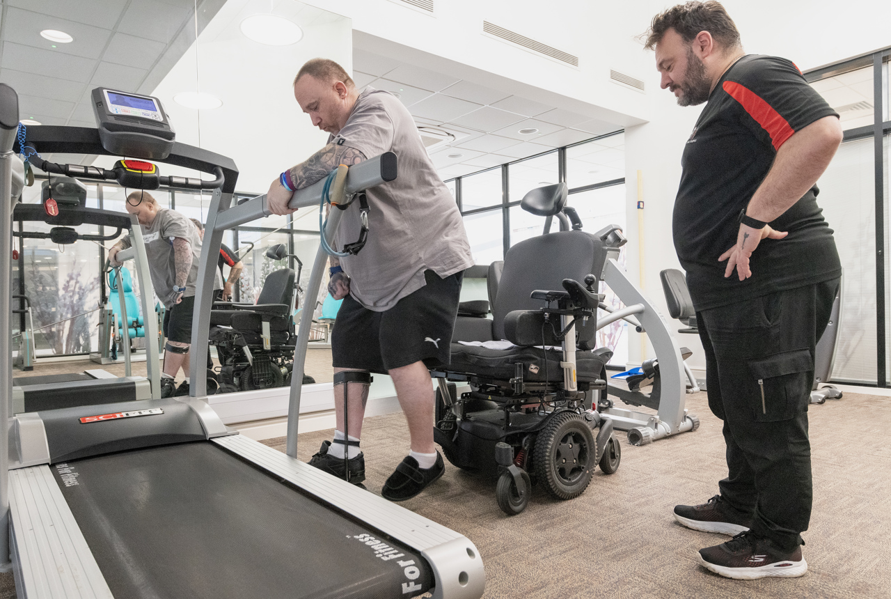 Chris, a Housing 21 resident, undertakes physiotherapy exercises under the supervision of his physio, Marc