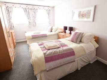 Robert Wheatman Court Twin Bedroom