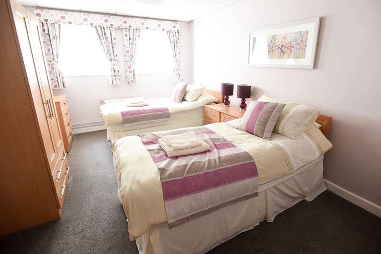 Robert Wheatman Court Twin Bedroom