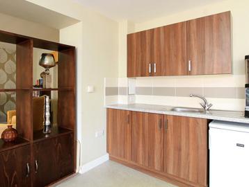 Communal kitchen area with sink and under counter fridge