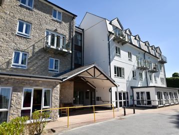 Front entrance of the building with blue skies above