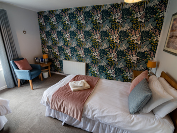 Recently decorated bedroom with two single beds