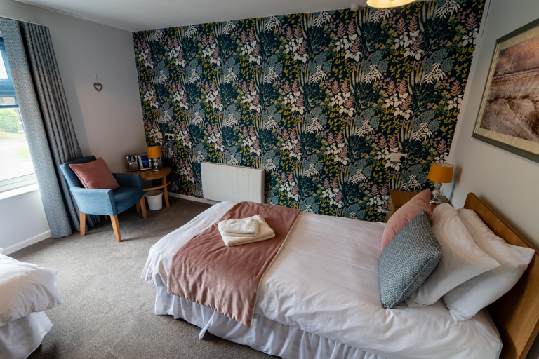 Recently decorated bedroom with two single beds