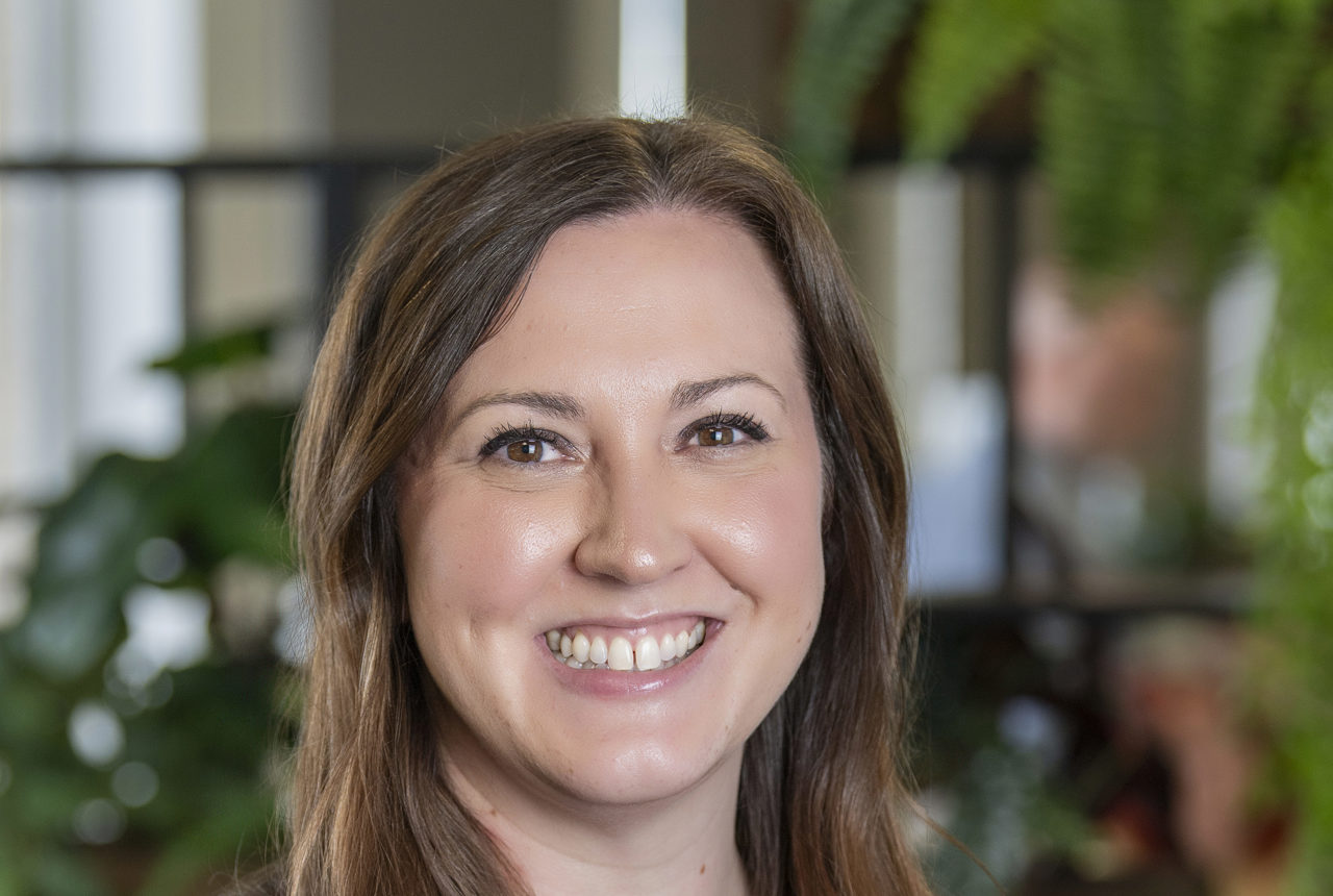 Head shot of a very smiley brown haired Kate McArdell-Broome, Director of Retirement Living