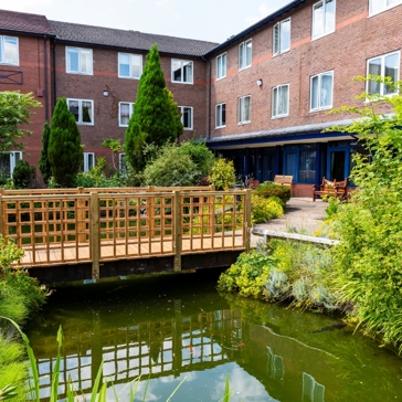 External image of Berryhill Retirement Village showing a pond with a bridge 