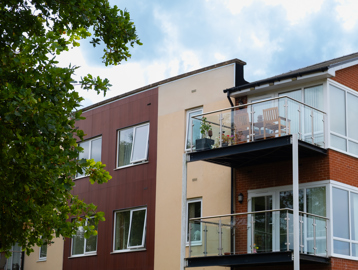 Looking up at some balconies on a bright day with blue skies