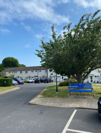 Car park and grassed area to the outside of the scheme 
