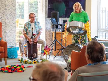 Residents being entertained by music in the communal lounge