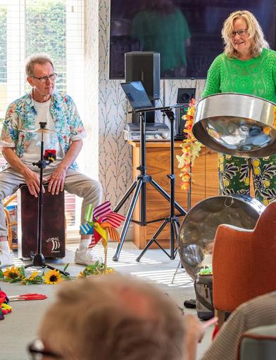 Residents being entertained by music in the communal lounge 