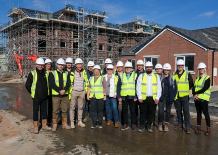 Key representatives pictured standing in front of Potter Court development for topping out ceremony 