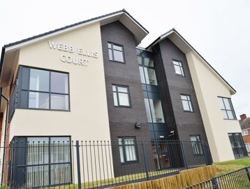 Large sign on the side of the building entrance to Webb Ellis Court